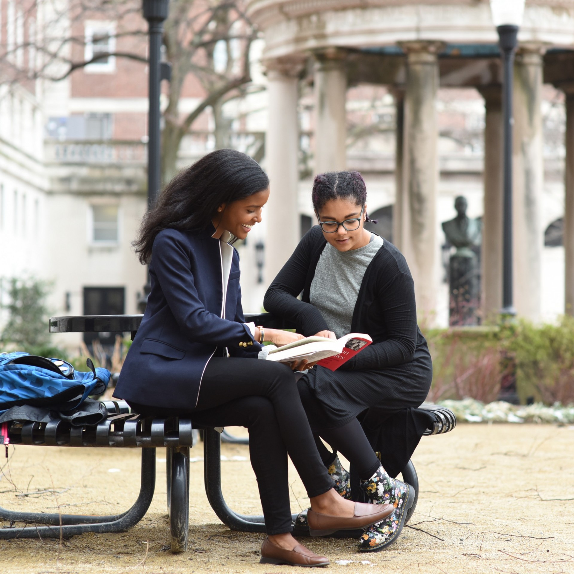 Dual BA students reading on Columbia campus