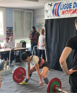 Charmaine Ko '24GS participating in a powerlifting competition