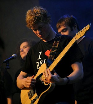 Dan playing the guitar