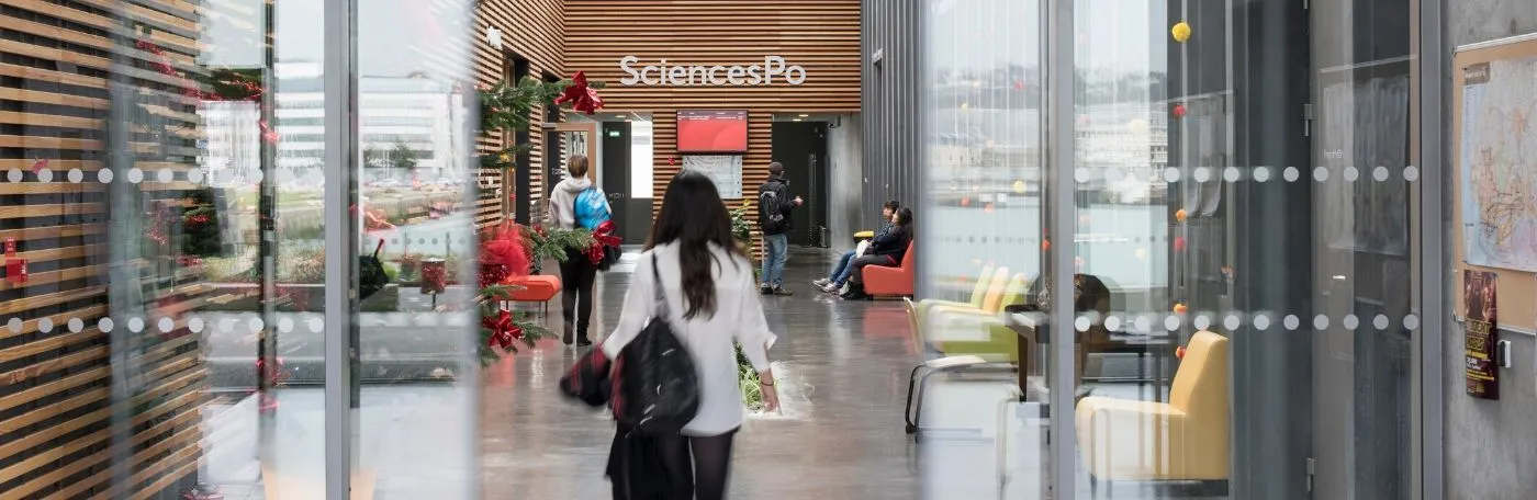 Student walking into building at Sciences Po