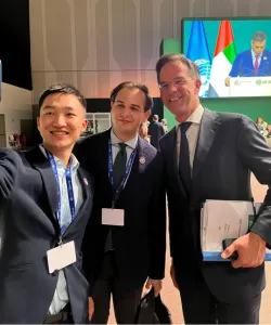 Louai Allani '25GS (center) with other COP28 participants