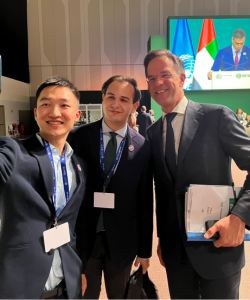 Louai Allani '25GS (center) with other COP28 participants